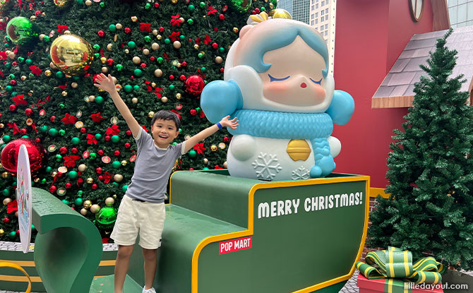 pose with a sleigh and colourful presents