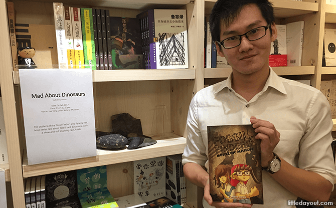 Andy Chua with his Mad About Dinosaurs Book